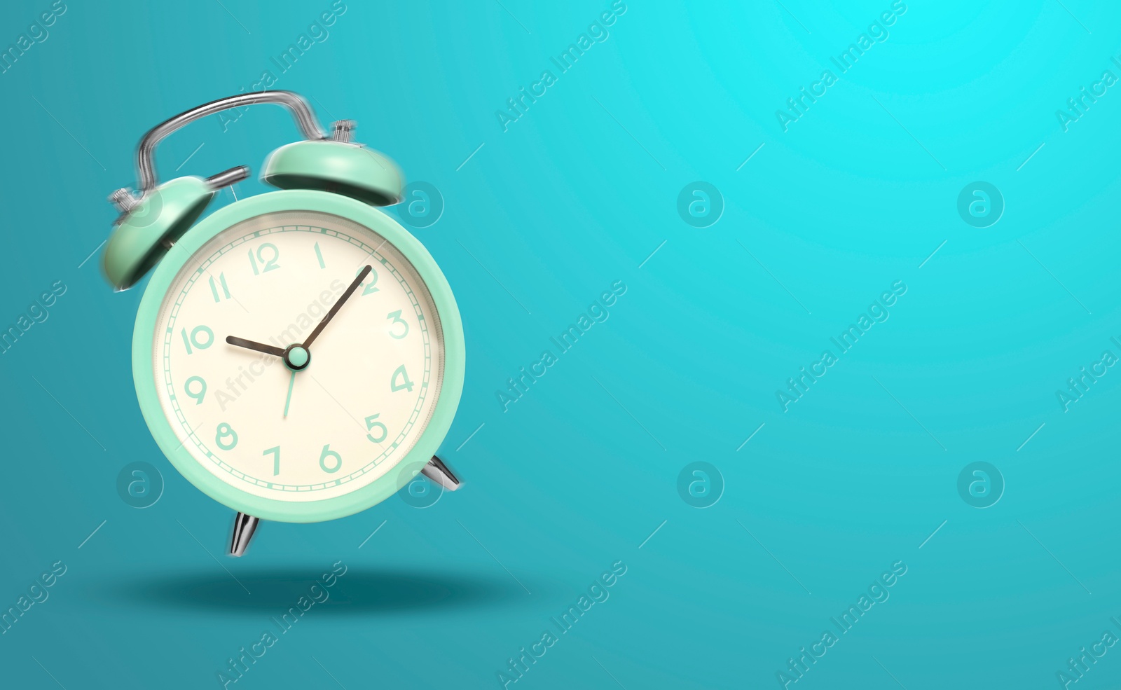 Turquoise alarm clock ringing and jumping on light blue background. Banner design with space for text Image of Turquoise alarm clock ringing and jumping on light blue background. Banner design with space for text