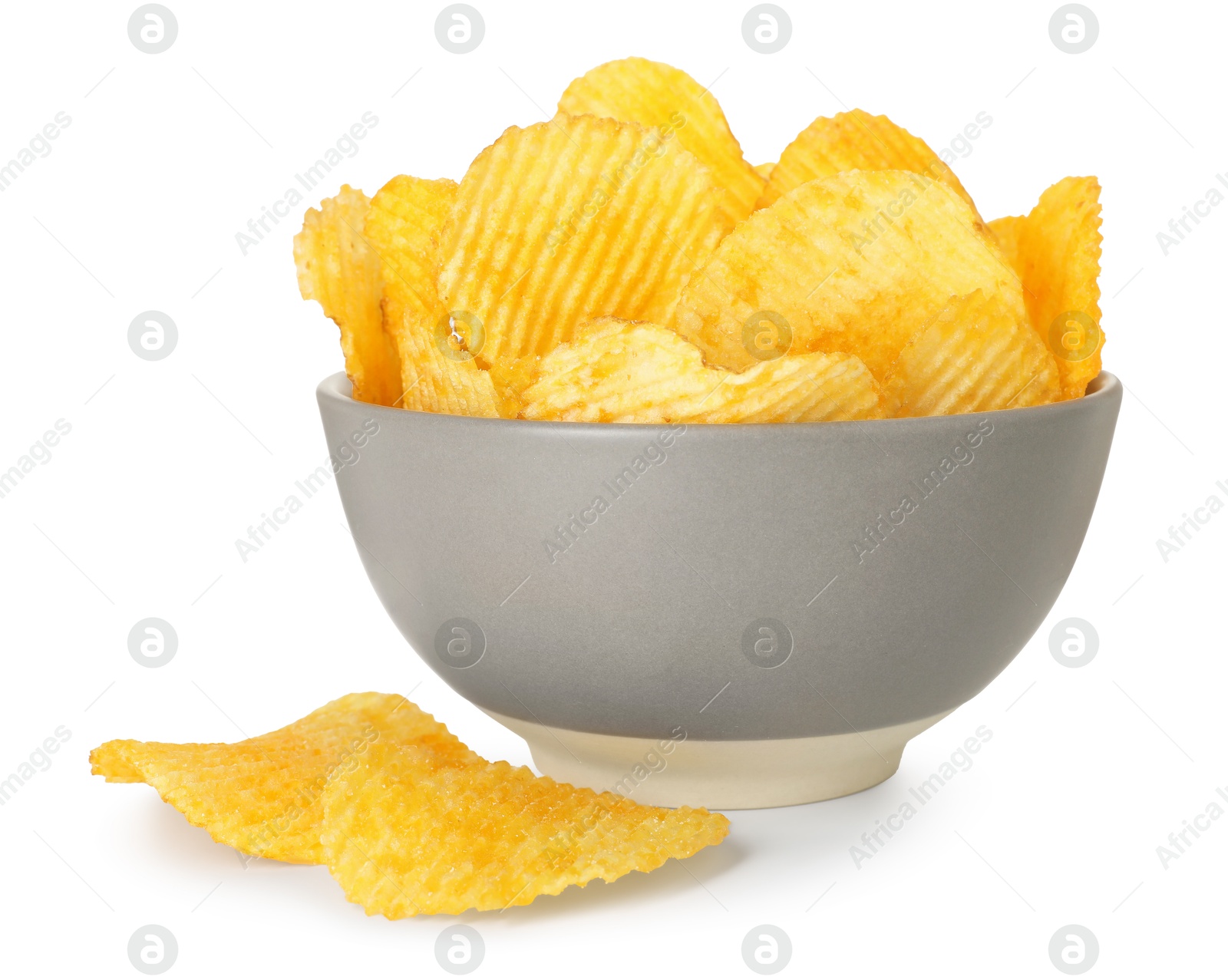 Tasty potato chips in bowl isolated on white Photo of Tasty potato chips in bowl isolated on white
