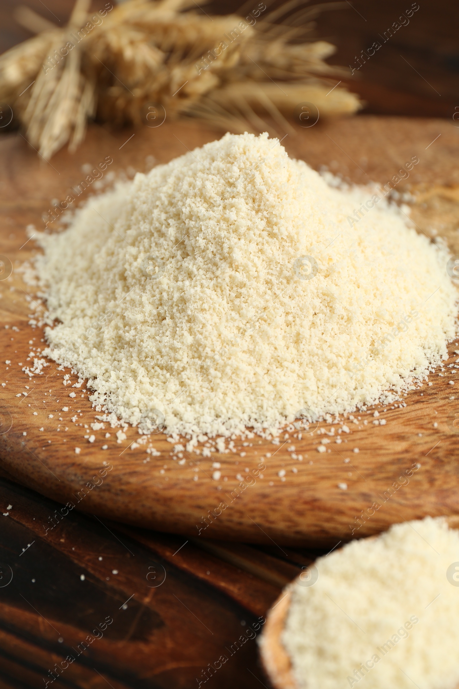Pile of flour and spikes on wooden table, closeup Photo of Pile of flour and spikes on wooden table, closeup