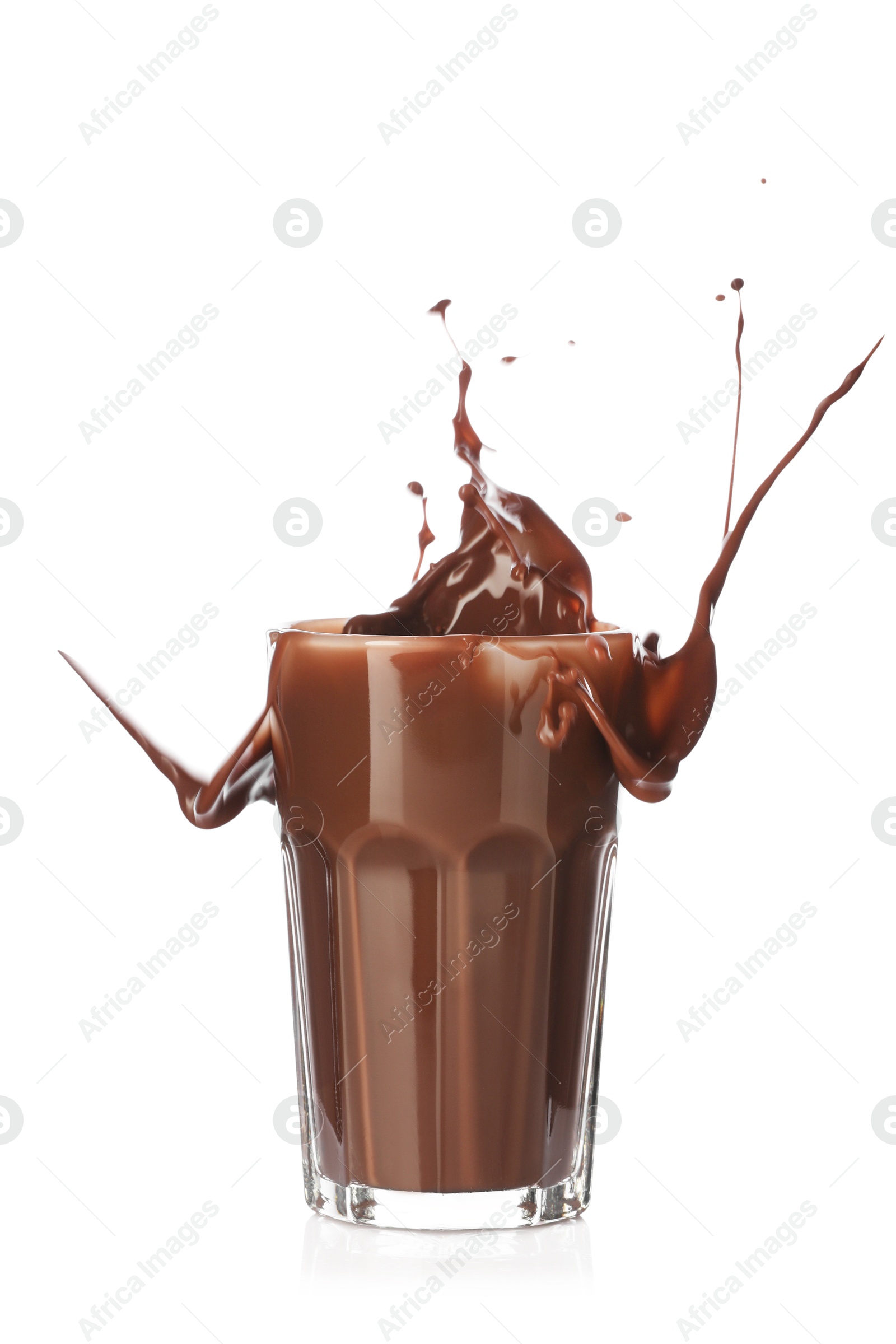 Tasty chocolate milk splashing in glass isolated on white Photo of Tasty chocolate milk splashing in glass isolated on white