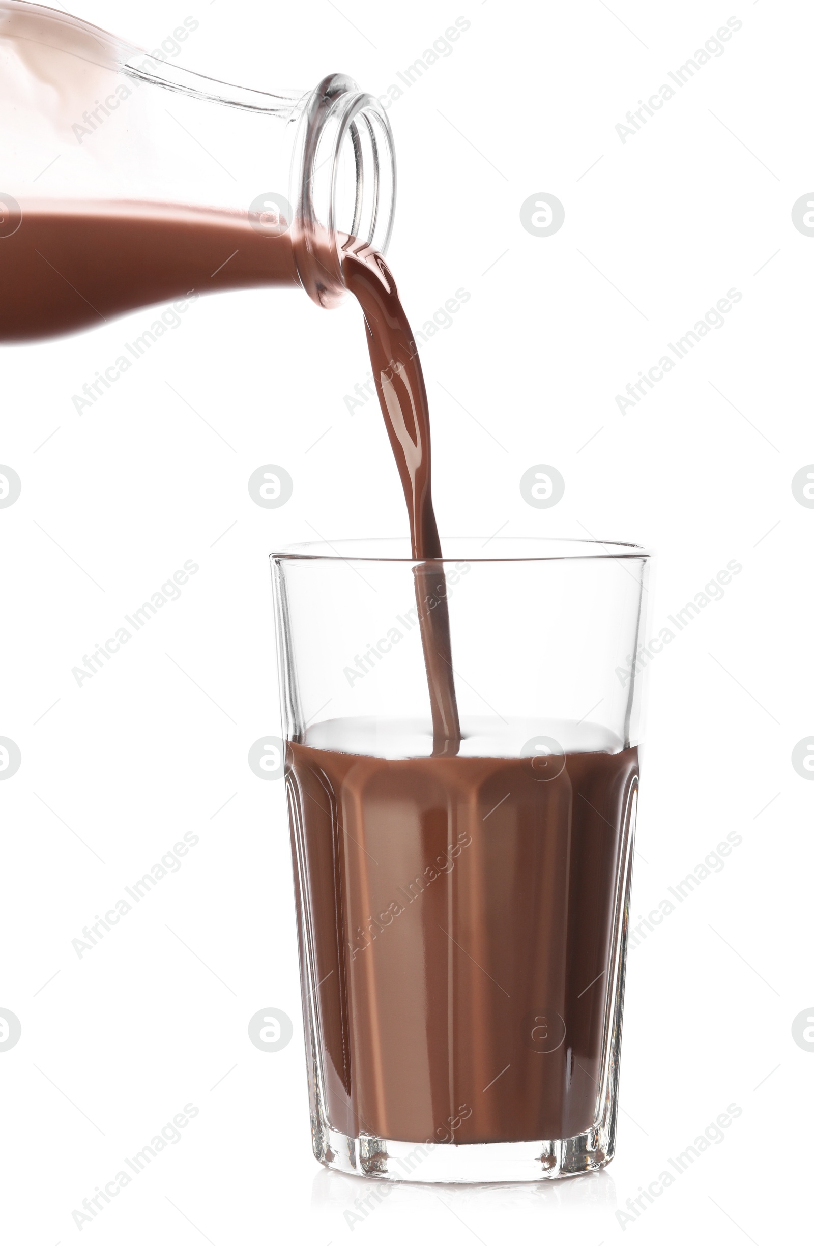 Pouring tasty chocolate milk into glass on white background, closeup Photo of Pouring tasty chocolate milk into glass on white background, closeup