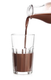 Photo of Pouring tasty chocolate milk into glass on white background, closeup