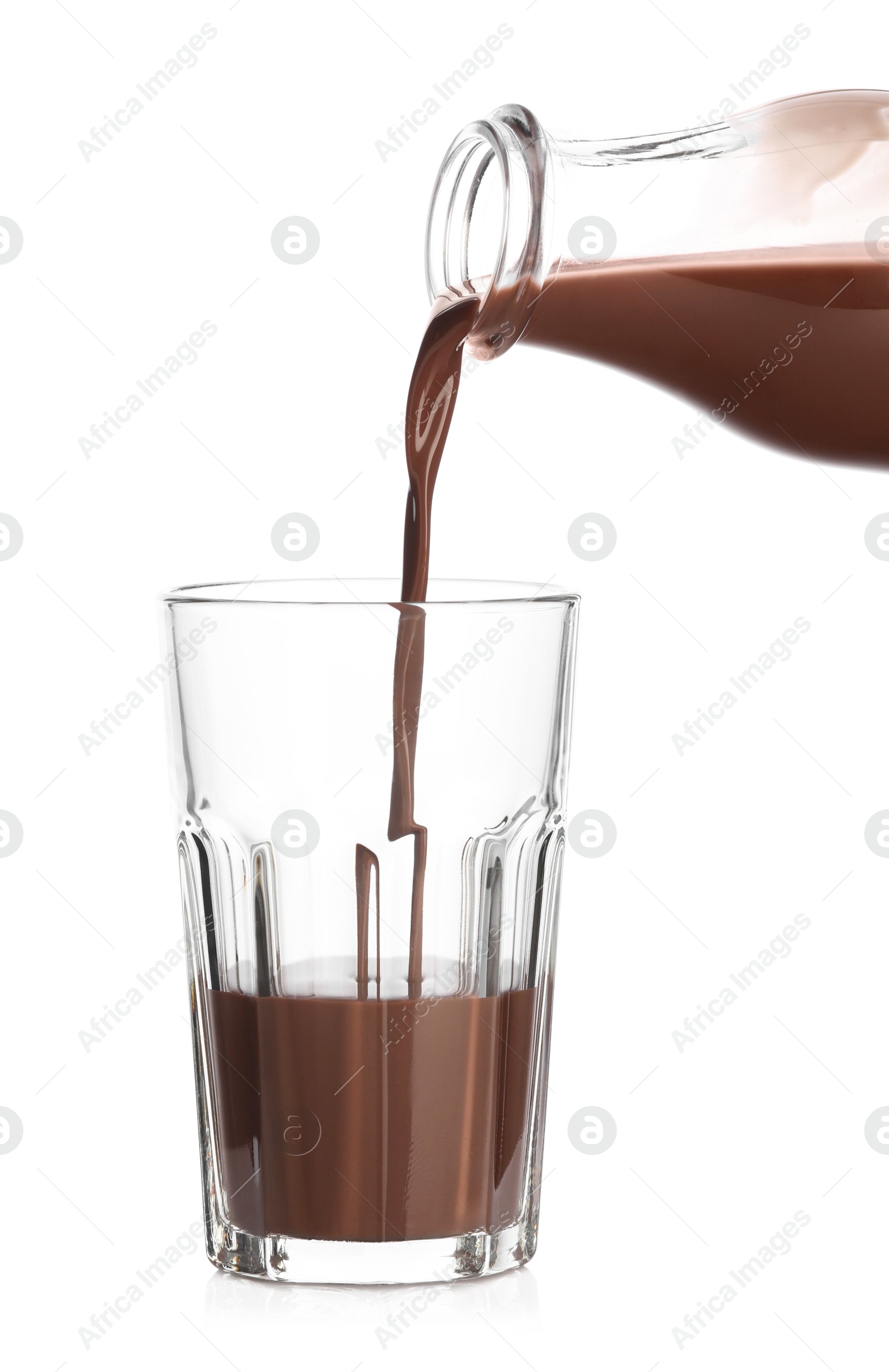 Pouring tasty chocolate milk into glass on white background, closeup Photo of Pouring tasty chocolate milk into glass on white background, closeup
