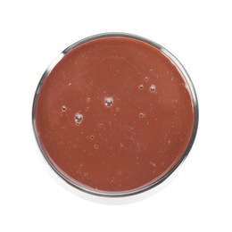 Photo of Tasty chocolate milk in glass isolated on white, top view