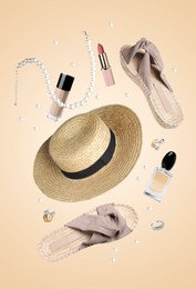 Image of Fashionable shoes, makeup products and accessories in air on beige background