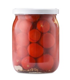 Photo of Tasty pickled tomatoes in jar isolated on white