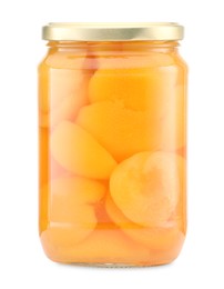 Photo of Tasty canned apricots in jar isolated on white