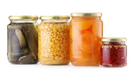 Photo of Many jars with different pickled products isolated on white
