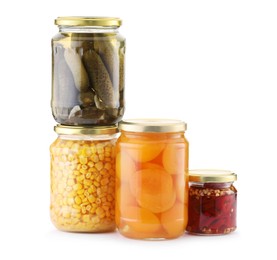 Photo of Many jars with different pickled products isolated on white