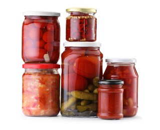 Photo of Many jars with different pickled products isolated on white