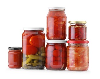 Photo of Many jars with different pickled products isolated on white
