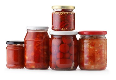 Photo of Many jars with different pickled products isolated on white