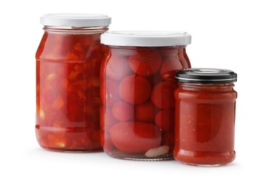 Photo of Many jars with different pickled products isolated on white