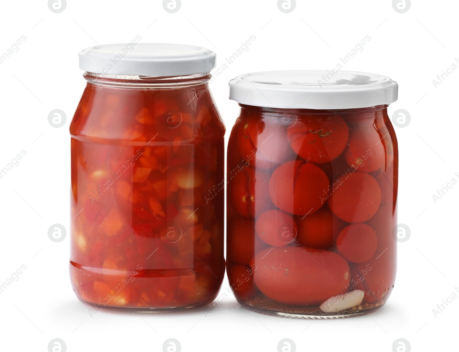 Tasty pickled products in jars isolated on white Photo of Tasty pickled products in jars isolated on white