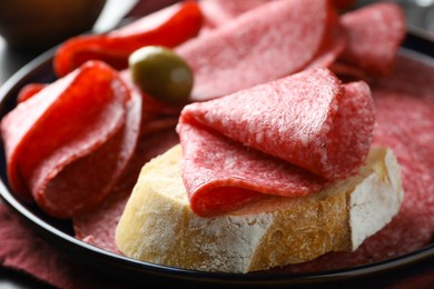 Photo of Sandwich with delicious sausage served on table, closeup