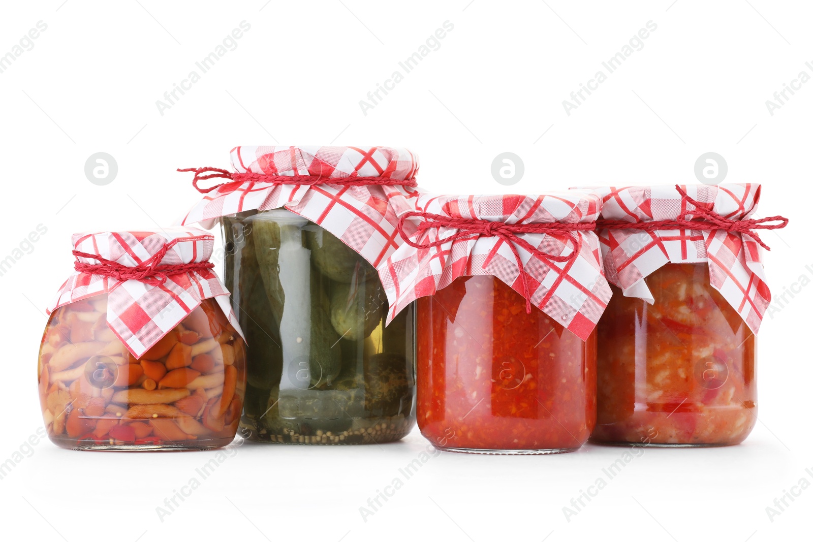 Many jars with different pickled products isolated on white Photo of Many jars with different pickled products isolated on white