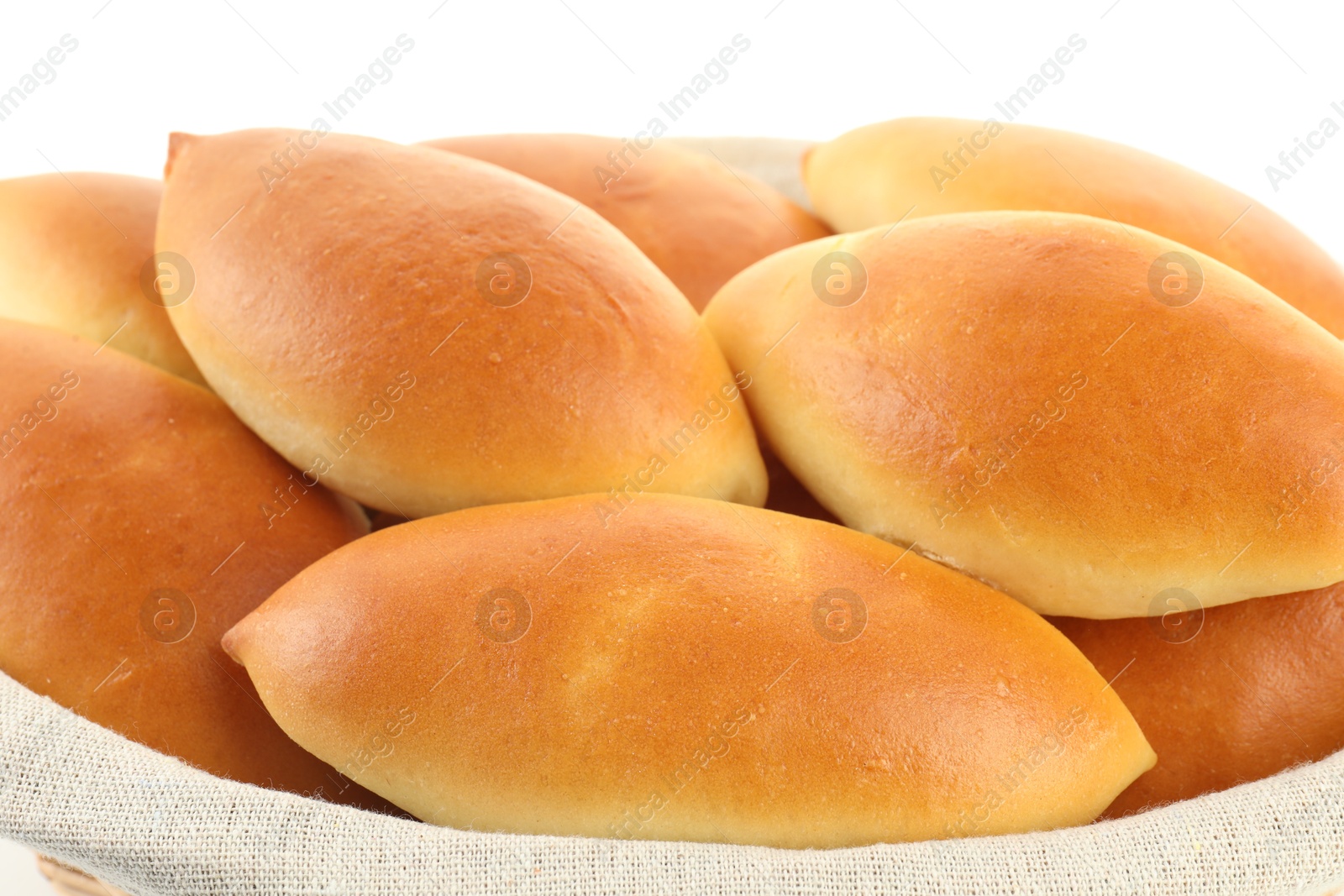 Tasty baked patties in basket isolated on white Photo of Tasty baked patties in basket isolated on white