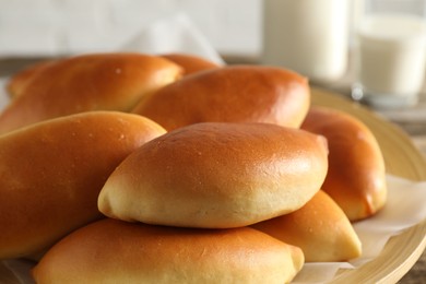 Photo of Many tasty baked patties on table, closeup