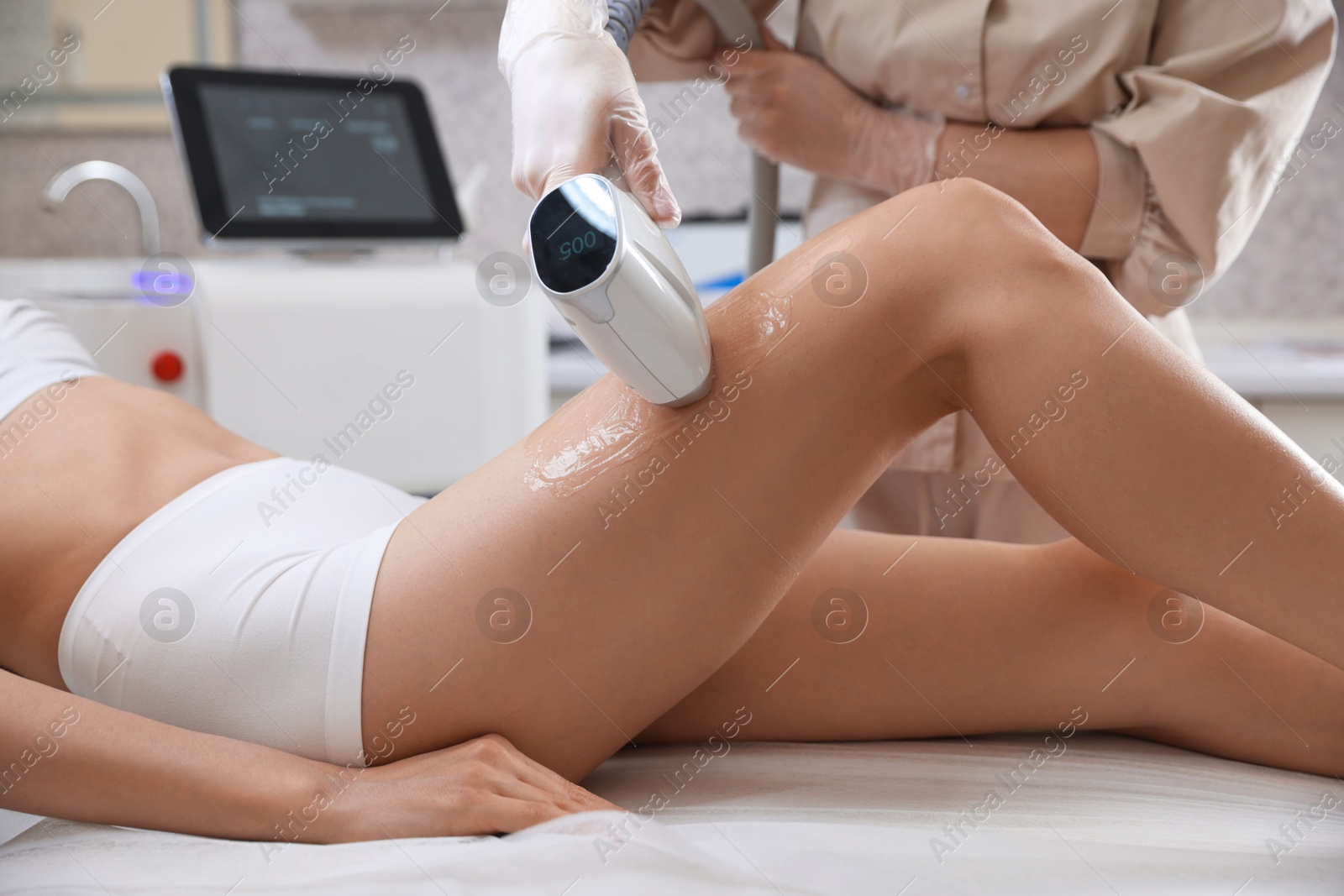 Woman during laser depilation procedure in beauty salon, closeup Photo of Woman during laser depilation procedure in beauty salon, closeup