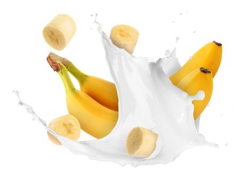 Image of Splash of milk with bananas and pieces in air on white background