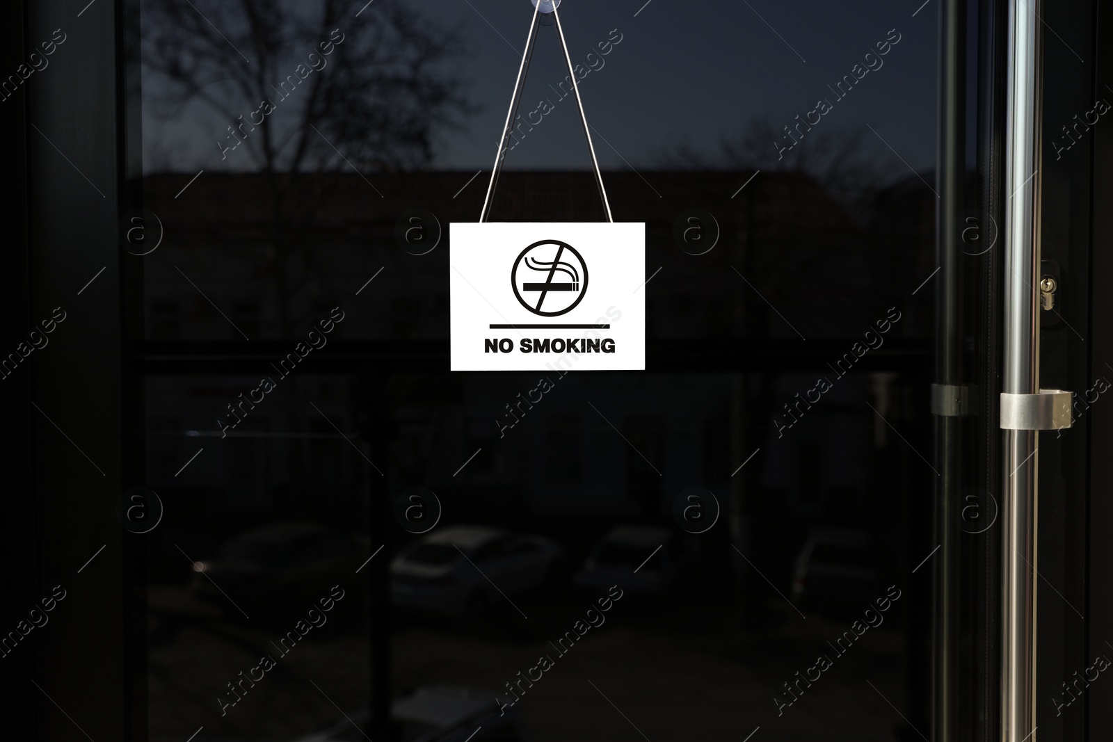 Image of No Smoking sign hanging on entrance door