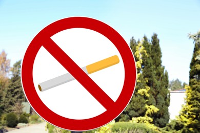 Image of No Smoking sign in park with green trees