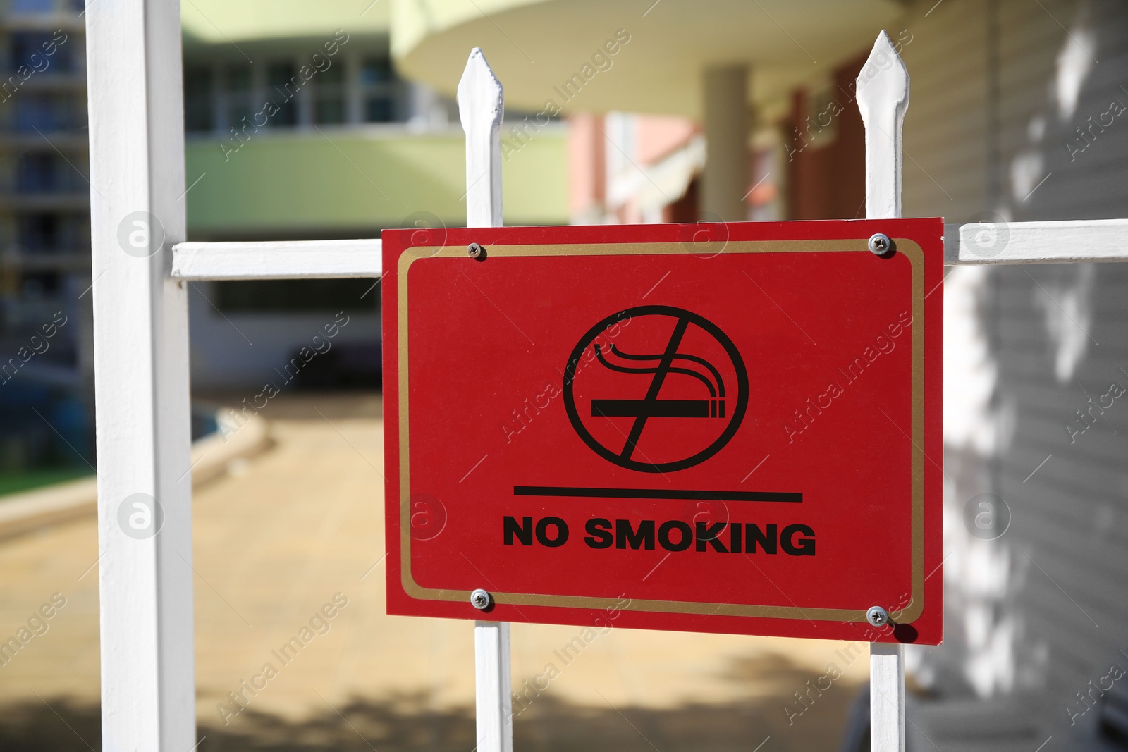 No Smoking sign on fence outdoors. Prohibition Image of No Smoking sign on fence outdoors. Prohibition