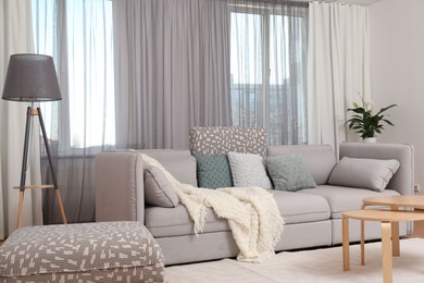 Photo of Windows with stylish curtains in living room interior