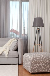 Photo of Window with stylish curtains in living room interior