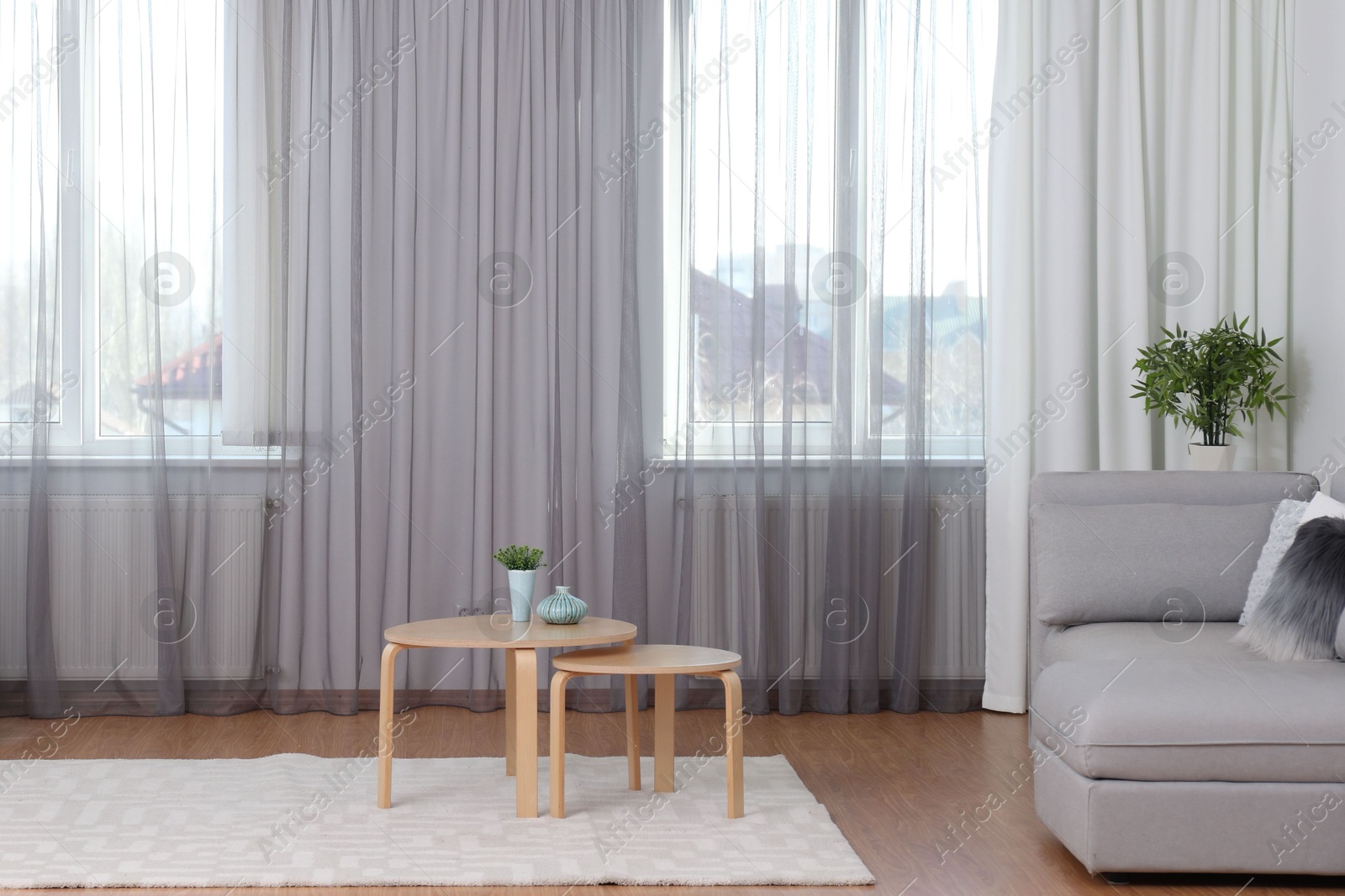 Windows with stylish curtains in living room interior Photo of Windows with stylish curtains in living room interior