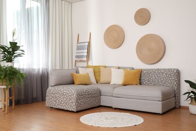 Photo of Window with stylish curtains in living room interior