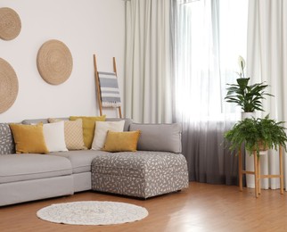 Photo of Window with stylish curtains in living room interior
