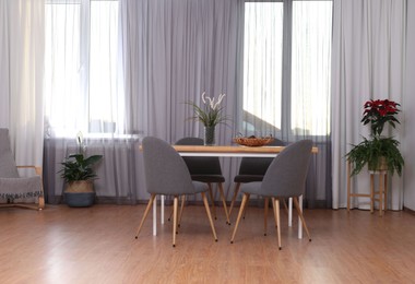 Photo of Windows with stylish curtains in living room interior