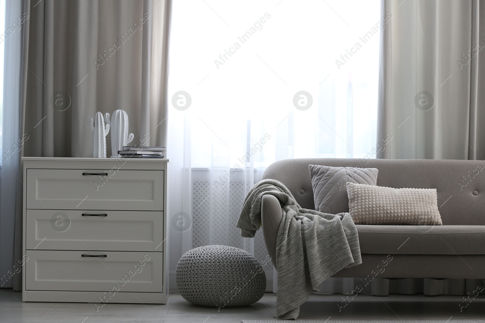 Beautiful curtains on window in stylish living room interior Photo of Beautiful curtains on window in stylish living room interior