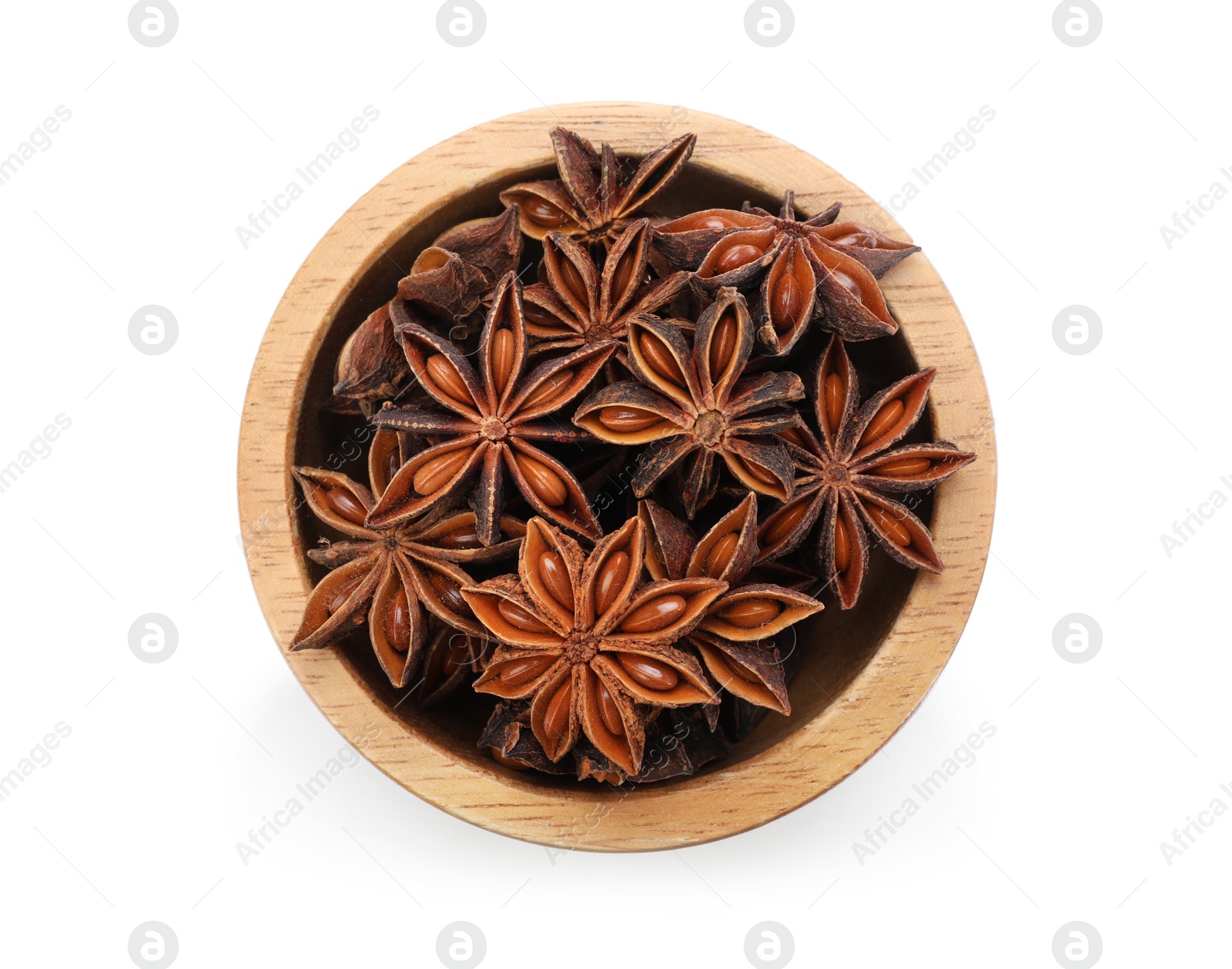 Aromatic anise stars in bowl isolated on white, top view Photo of Aromatic anise stars in bowl isolated on white, top view
