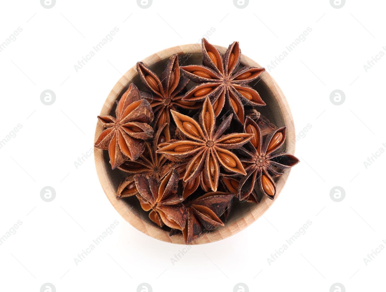 Aromatic anise stars in bowl isolated on white, top view Photo of Aromatic anise stars in bowl isolated on white, top view
