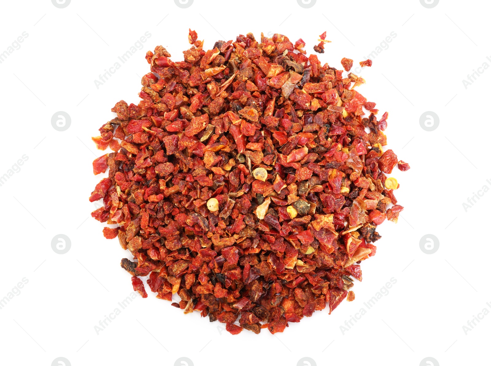 Pile of red chili pepper flakes isolated on white, top view Photo of Pile of red chili pepper flakes isolated on white, top view