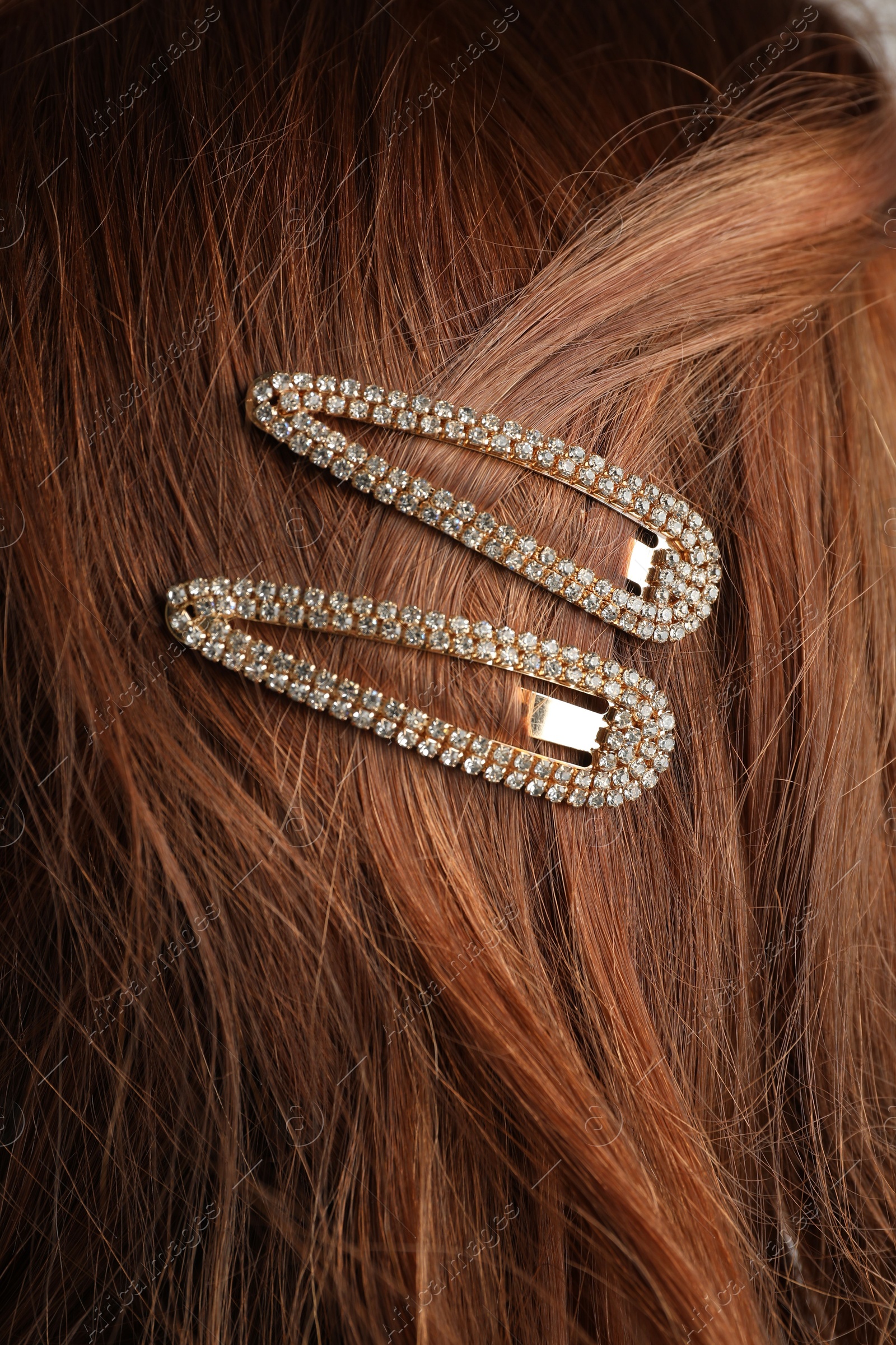 Woman with beautiful hair clips, closeup view Photo of Woman with beautiful hair clips, closeup view