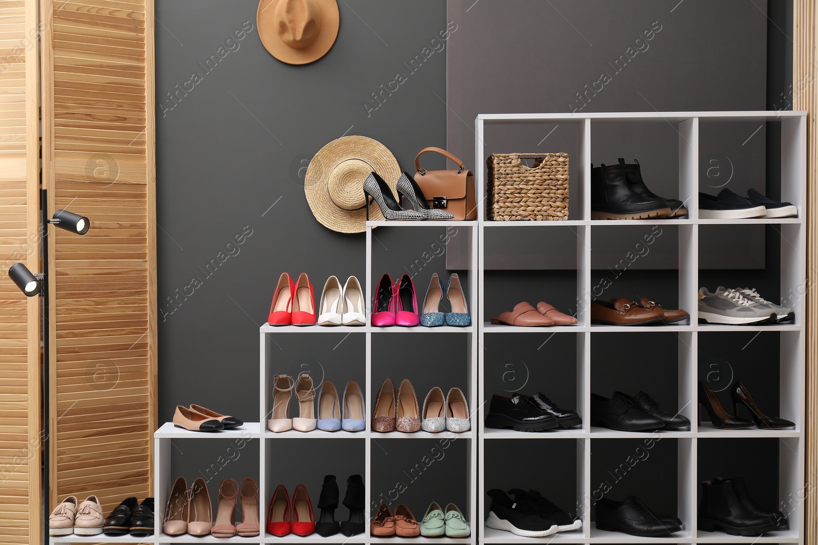 Shoe storage. Shelving unit with different high heeled shoes and accessories indoors Photo of Shoe storage. Shelving unit with different high heeled shoes and accessories indoors