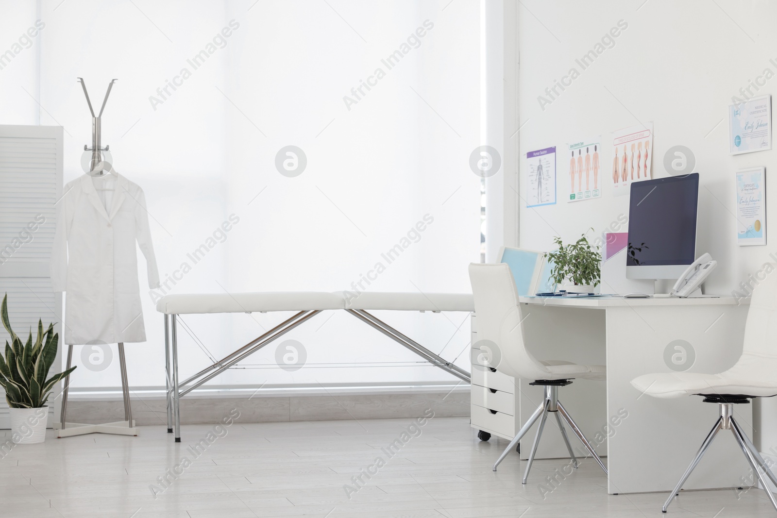 Doctor's workplace with modern computer in office Photo of Doctor's workplace with modern computer in office