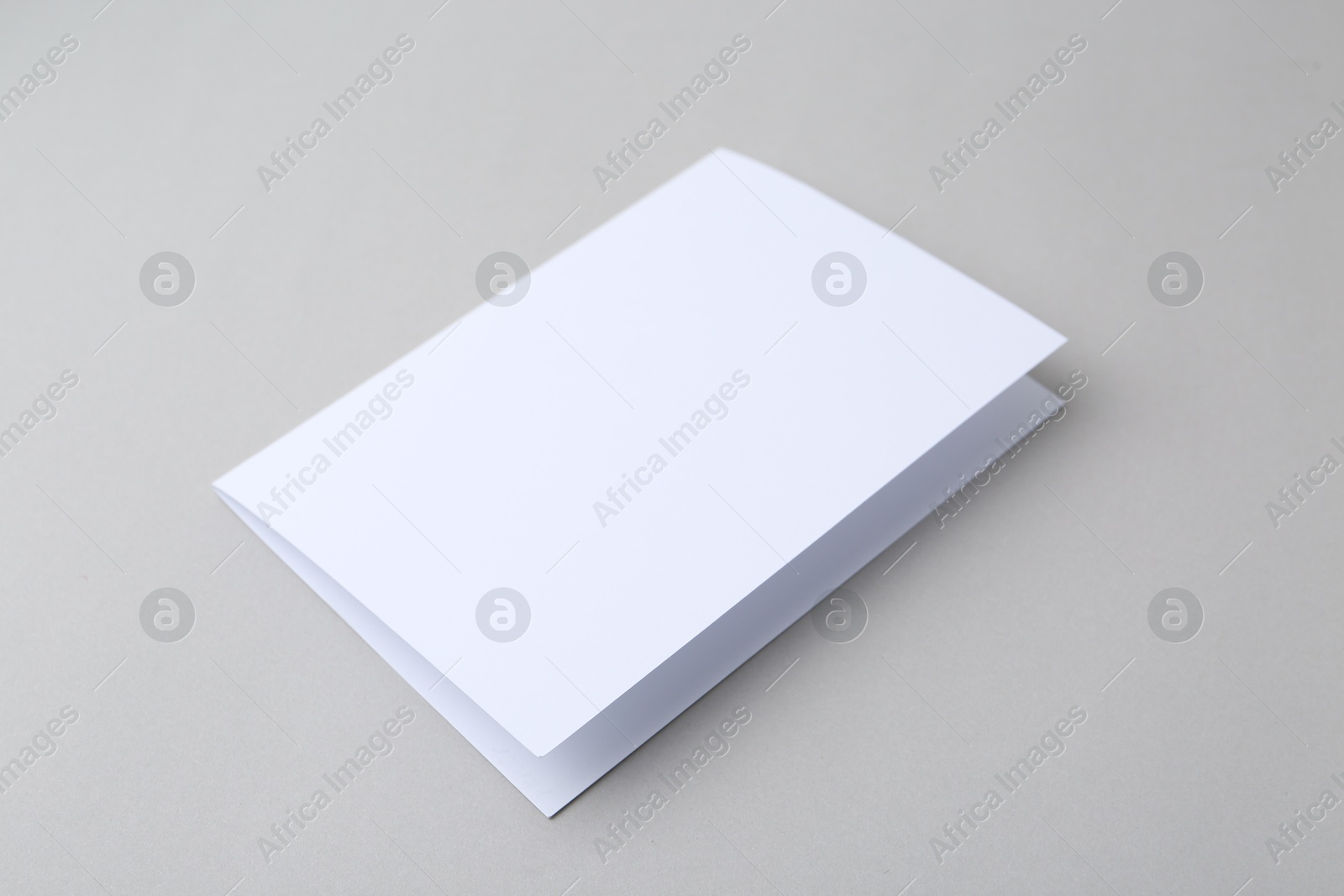 Blank greeting card on light background, closeup Photo of Blank greeting card on light background, closeup