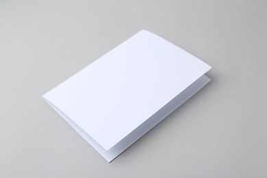 Photo of Blank greeting card on light background, closeup