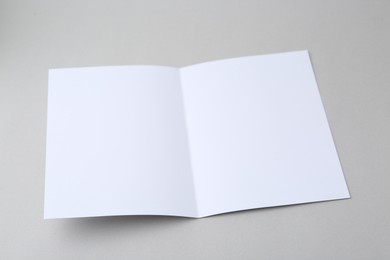 Photo of Blank greeting card on light background, closeup