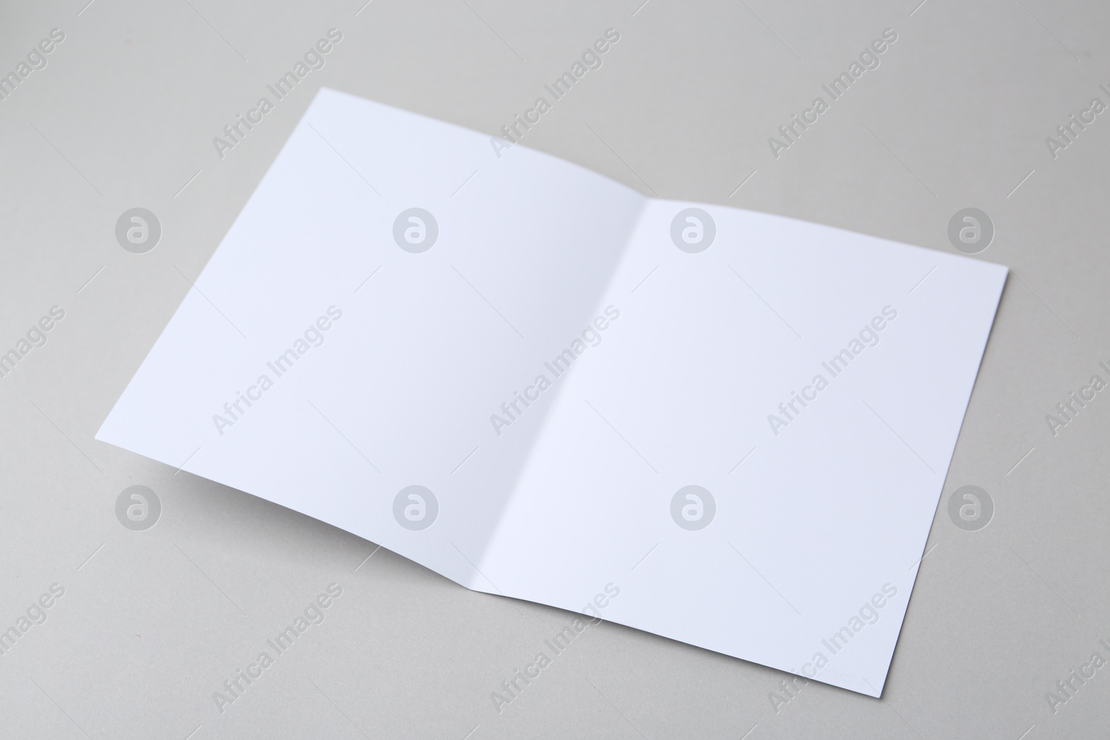 Photo of Blank greeting card on light background, closeup