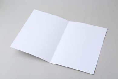 Photo of Blank greeting card on light background, closeup