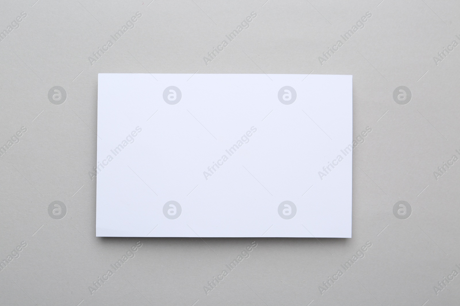 Photo of Blank greeting card on light background, top view