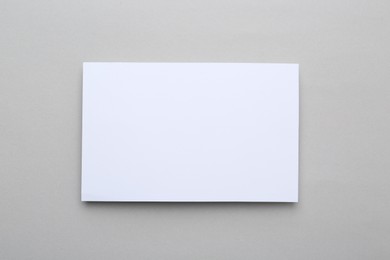 Photo of Blank greeting card on light background, top view