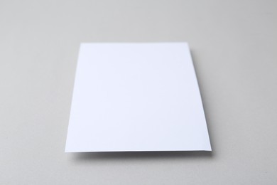 Photo of Blank greeting card on light background, closeup