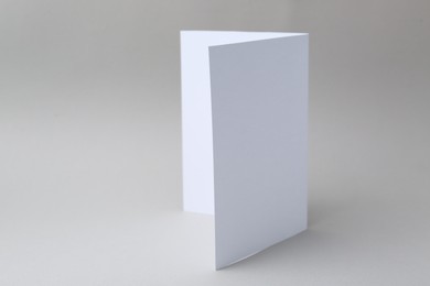 Photo of One blank greeting card on light background