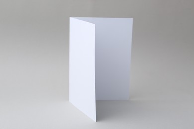 Photo of One blank greeting card on light background